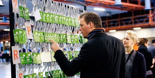 man trying to choose a name on a board full of name tags